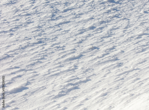 The snow is white and the ground is covered in it