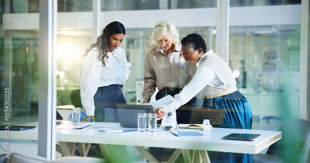 Obraz premium Business women, discussion and documents with laptop for company statistics, analysis or project ideas at office. Female people, employees or colleagues with computer for budget review or performance
