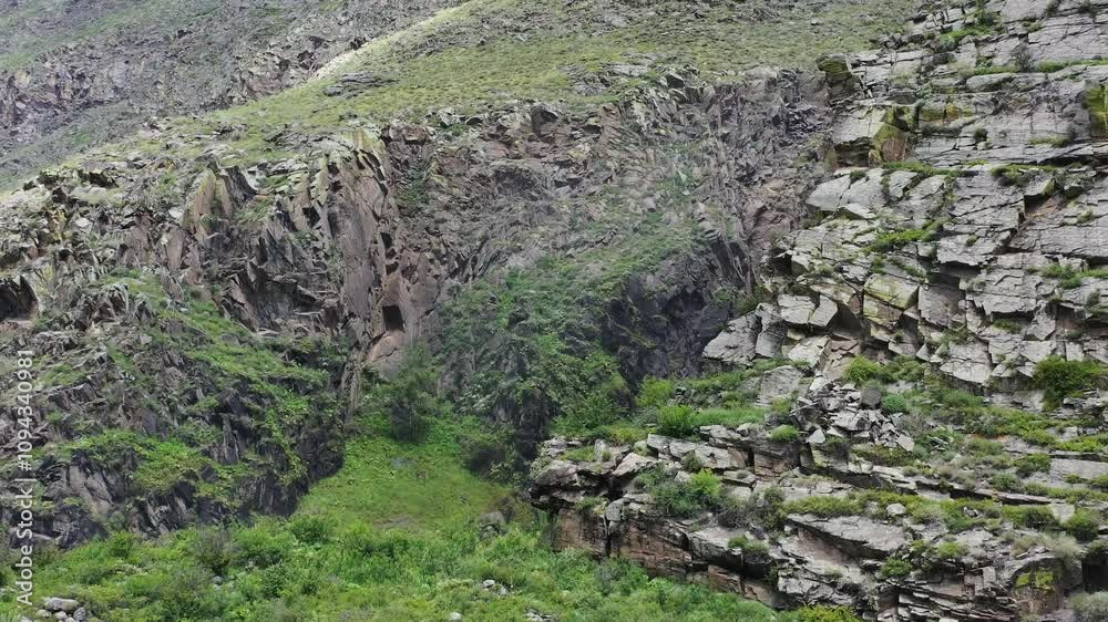 Drone view of rocky mountains and waterfall. Drone view of rocky mountains and waterfall.