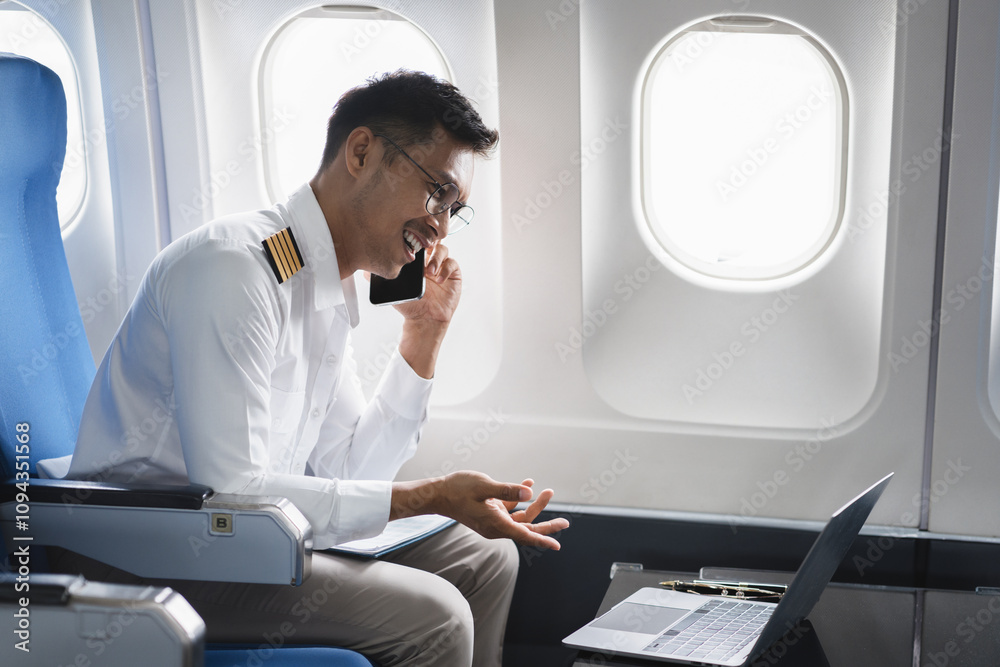 Successful serious airplane captain pilot preparing for flight at Airport. Successful serious airplane captain pilot preparing for flight at Airport.