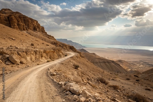 Desert dirt road traversing a rocky hillside near the Dead Sea, rocky hillside, dirt road