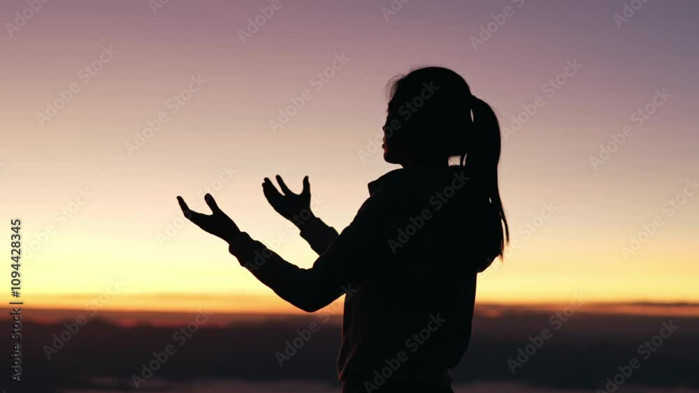 Silhouette of woman in intense prayer before betrayal and crucifix, gethsemane, prayer ministry.4k slow motion video.