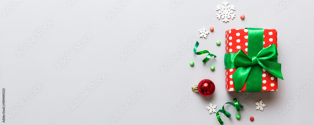 Top view Flat lay Christmas decorations and gift box on colored background with copy space. Christmas or Happy New Year composition Top view Flat lay Christmas decorations and gift box on colored background with copy space. Christmas or Happy New Year composition