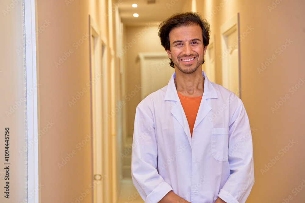 Indian doctor specializing in hair transplant standing in clinic