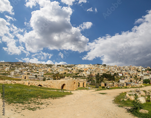 Roman ruins (against the background of a beautiful sky with clouds) in the Jordanian city of Jerash (Gerasa of Antiquity), capital and largest city of Jerash Governorate, Jordan #1094497111