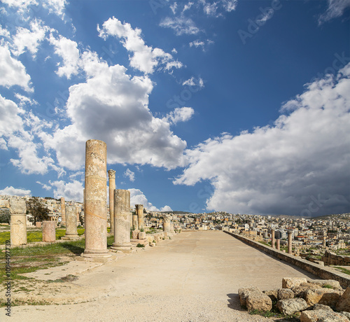 Roman ruins (against the background of a beautiful sky with clouds) in the Jordanian city of Jerash (Gerasa of Antiquity), capital and largest city of Jerash Governorate, Jordan