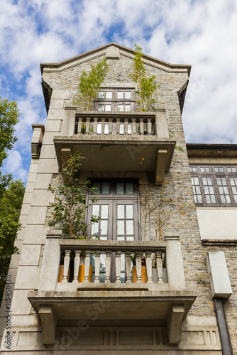 Balconies on a historic house in the Xintiandi district in Shanghai, China photo