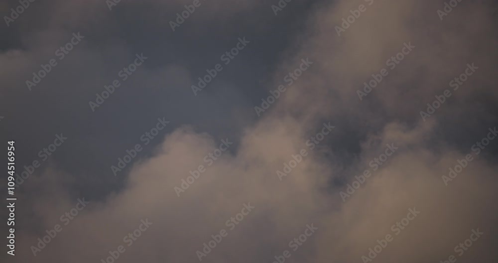 Beautiful timelapse of soft clouds drifting through evening sky, showcasing smooth transitions between blue and golden hues, perfect for cinematic backgrounds and nature visuals Beautiful timelapse of soft clouds drifting through evening sky, showcasing smooth transitions between blue and golden hues, perfect for cinematic backgrounds and nature visuals