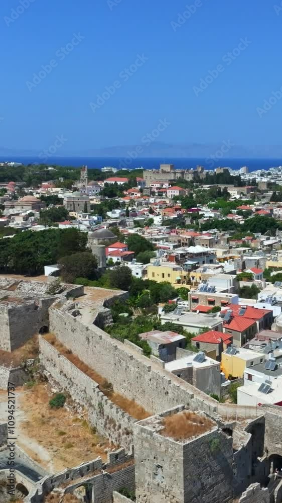 Vertical drone shot over the walls of the old town of Rhodes city, sunny Greece Vertical drone shot over the walls of the old town of Rhodes city, sunny Greece