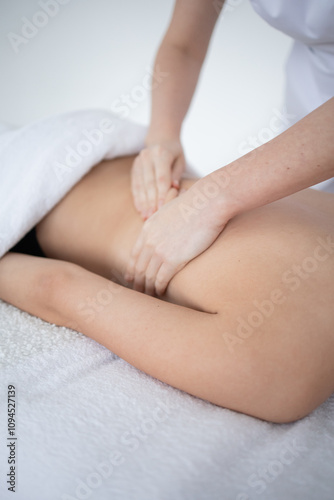 Close-up of masseur's hands on back. close-up masseur hands doing back massage in spa salon. Beauty treatment concept.