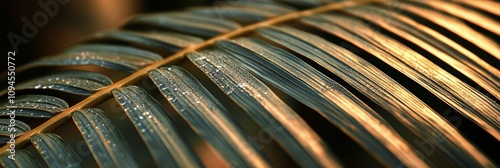 Water droplets glisten on palm fronds in a lush tropical environment during e...