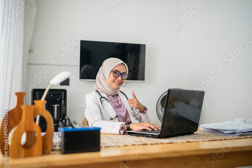 A qualified professional woman wearing a sleek white coat engaged in a virtual online consultation photo