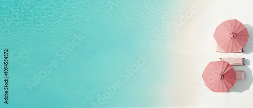 Beachside relaxation with pink umbrellas on sandy shore in bright sunlight