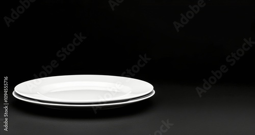 Simple white plate with a smooth finish for dining and serving culinary creat...