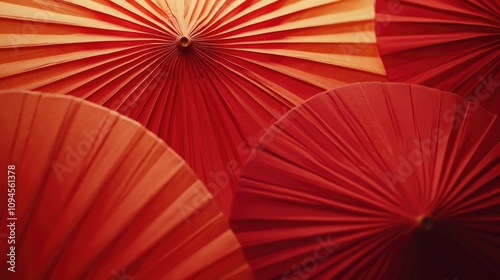 Vibrant close-up of decorative red paper lanterns showcasing intricate pleats and textures, ideal for festive celebrations and cultural events.