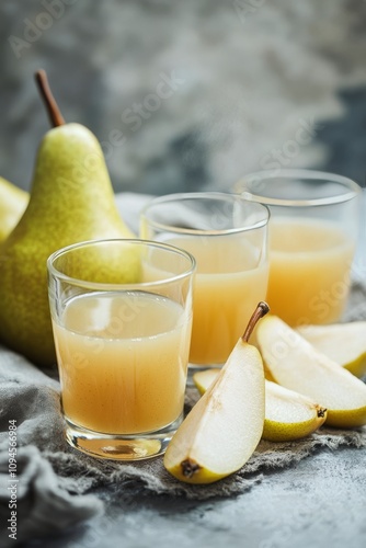 Refreshing pear juice served with fresh pear slices on a rustic table