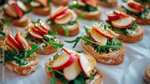 Delicious appetizers with fresh apples and greens on crunchy bread arranged f...