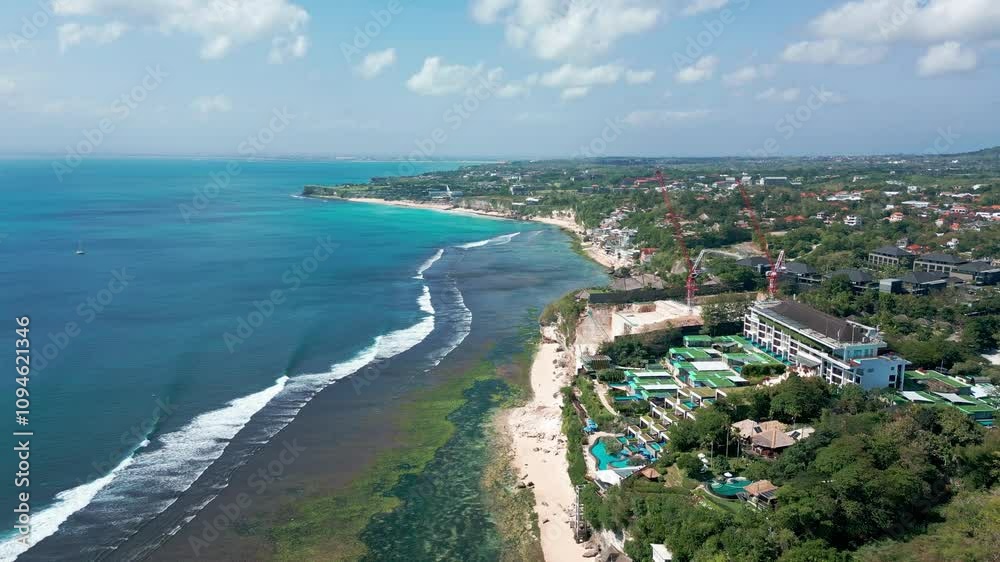 Aerial View Of Coastline And Hotels In Front Padang Padang Beach In Bali, Indonesia. Wide shot Aerial View Of Coastline And Hotels In Front Padang Padang Beach In Bali, Indonesia. Wide shot
