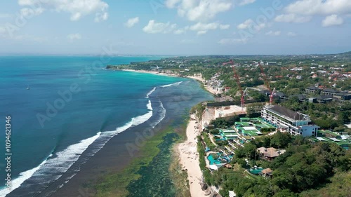 Aerial View Of Coastline And Hotels In Front Padang Padang Beach In Bali, Indonesia. Wide shot photo