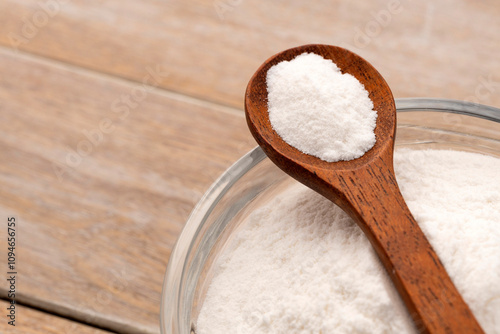 Baking soda powder in spoon and bowl - Healthy food.