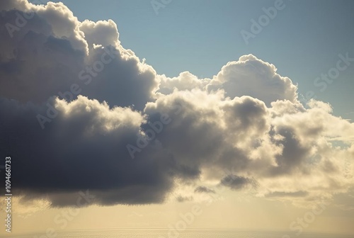 _ . Edge-Lit Clouds Over the Ocean The edges of clouds are illum photo