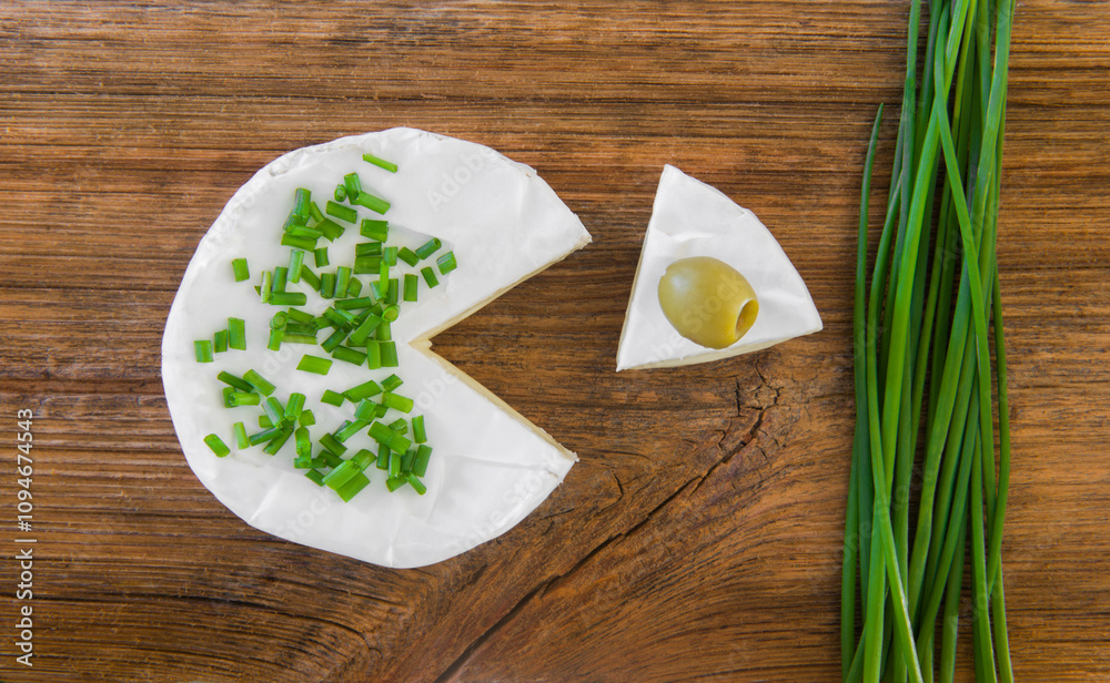 Delicious Camembert cheese, olives, chives