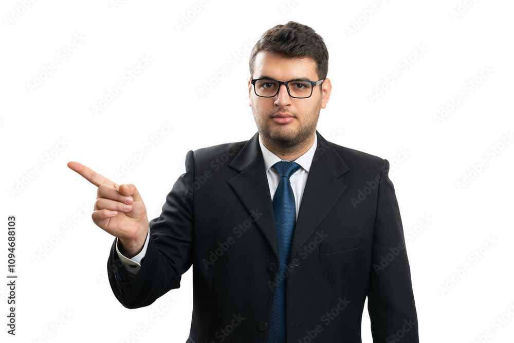 Serious entrepreneur man pointing index finger at copyspace Serious entrepreneur man pointing index finger at copyspace