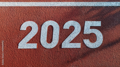 2025 logo on textured running track, symbolizing new beginnings, fitness, and personal growth photo