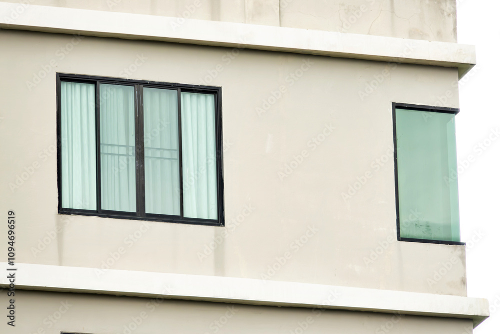 A building with a window that is open. The window is next to a window that is closed A building with a window that is open. The window is next to a window that is closed