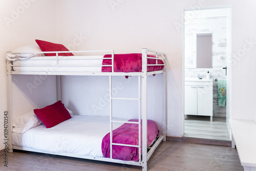 Canvastavla Empty hostel room with bunk beds and pink blankets