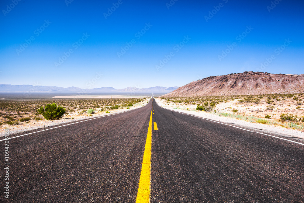 Empty scenic road in a Death Valley National Park , Nevada , USA Empty scenic road in a Death Valley National Park , Nevada , USA