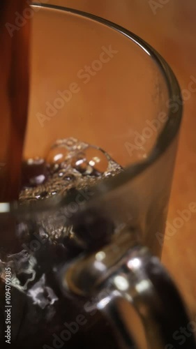 coffee is poured into a glass cup. coffee foam