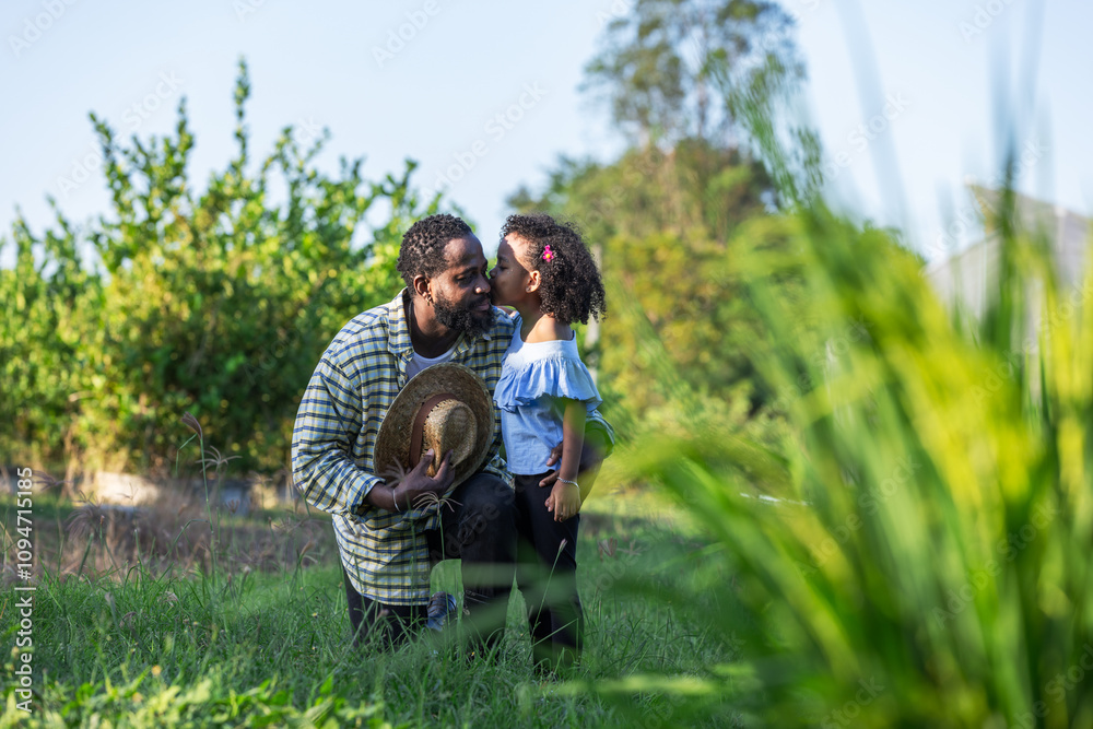 Fototapeta premium Father and Daughter Sharing a Sweet Moment in the Field, Embracing Love and Connection in Nature, Greenhouse Background, Family Bond, Rural Life, Happy Memories on a Beautiful Sunny Day