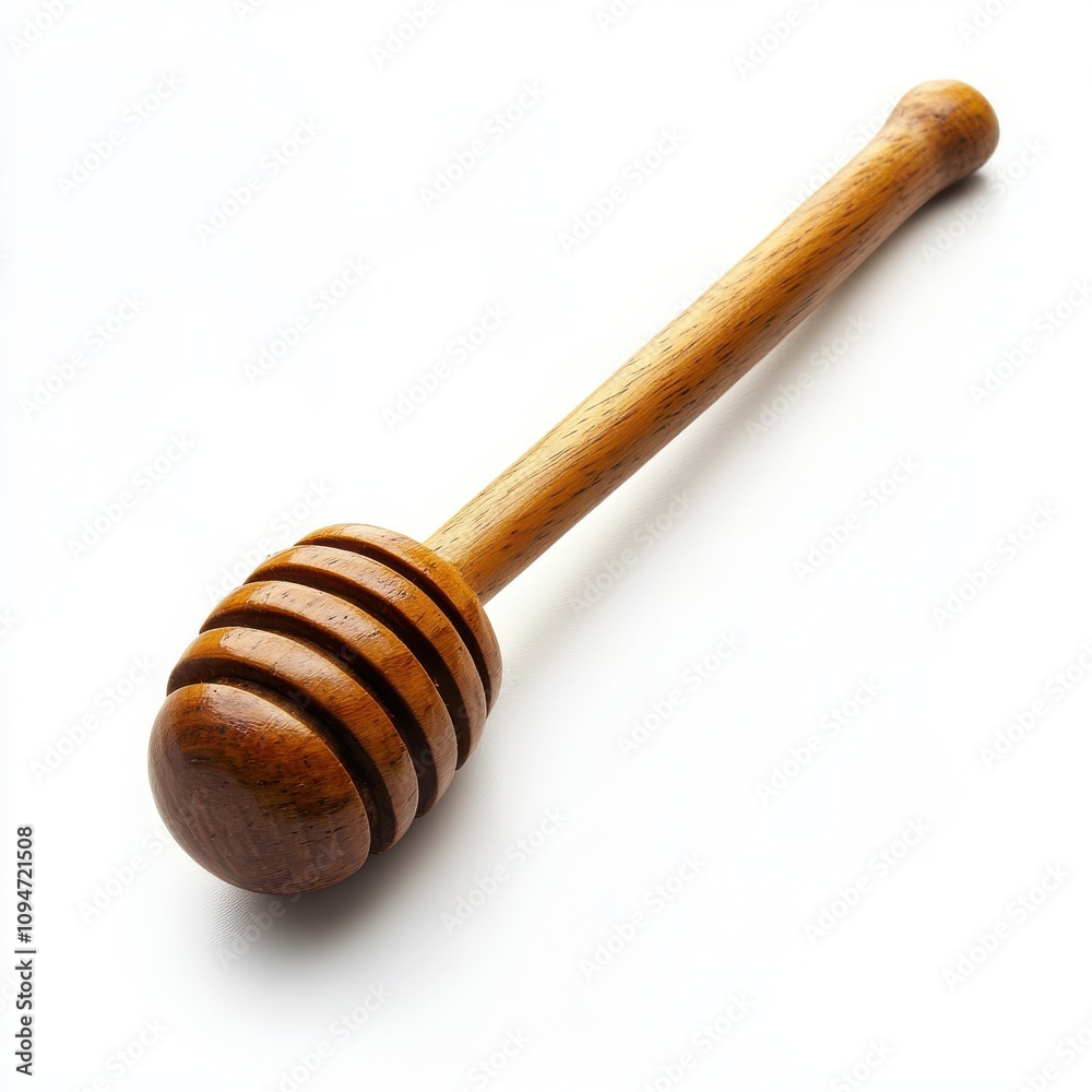 A wooden honey dipper with smooth rounded grooves slightly angled to emphasize its design isolated on a white background