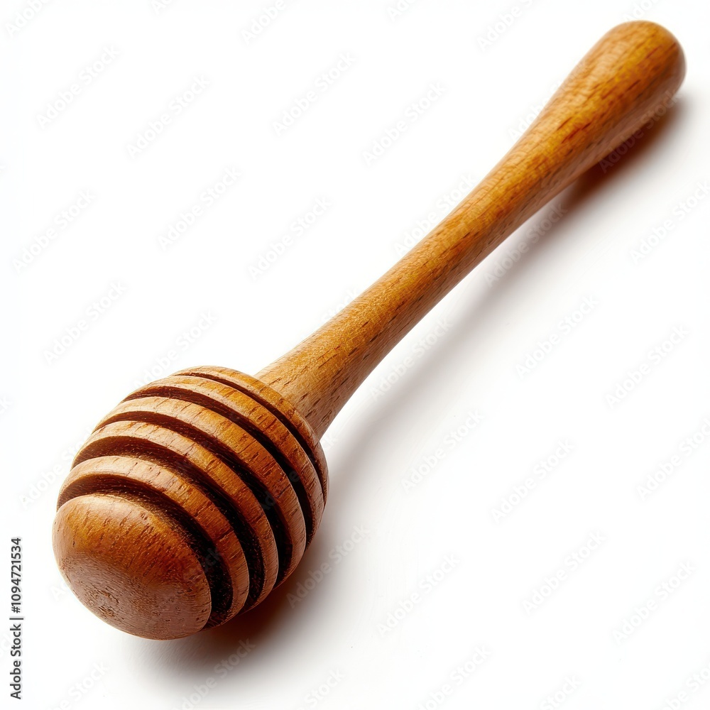 A wooden honey dipper with smooth rounded grooves slightly angled to emphasize its design isolated on a white background A wooden honey dipper with smooth rounded grooves slightly angled to emphasize its design isolated on a white background