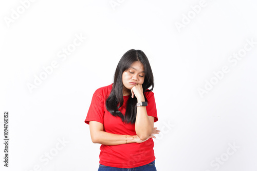 beautiful Asian woman looks tired and sleepy, leaning on one palm, set against a white background