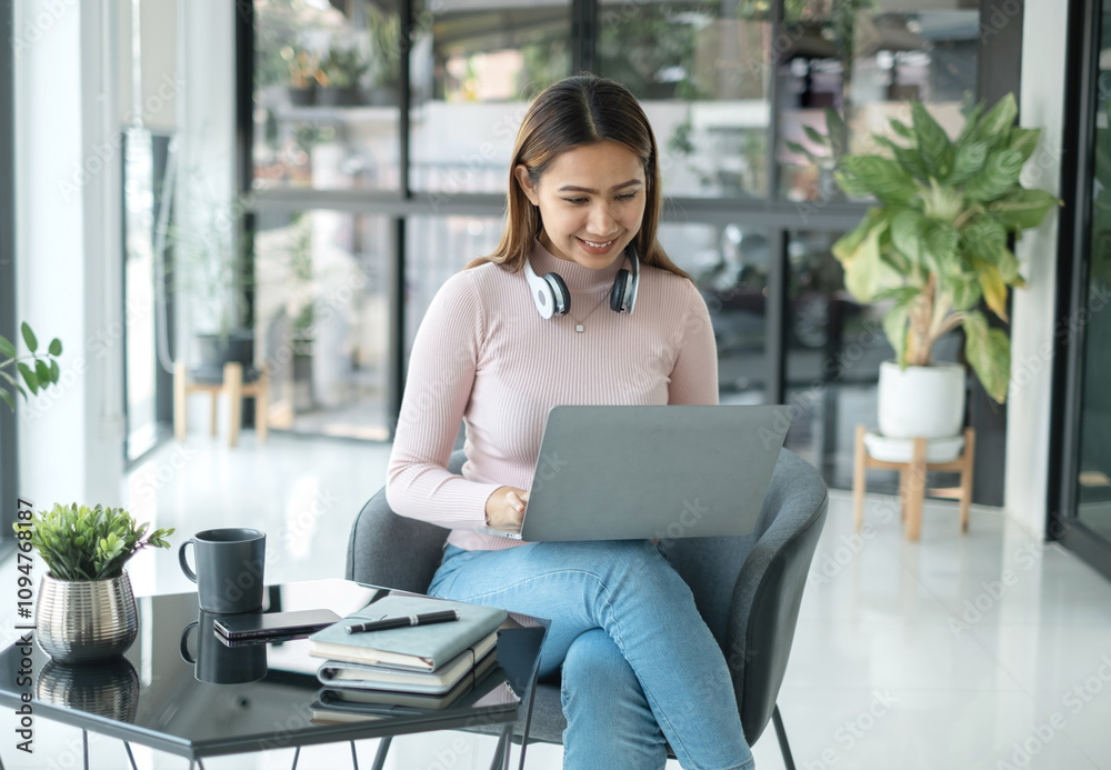 Female CEO in casual wear smiling and using tablet working Shown on the digital screen analyze and calculate the planning strategy for modern business Female CEO in casual wear smiling and using tablet working Shown on the digital screen analyze and calculate the planning strategy for modern business