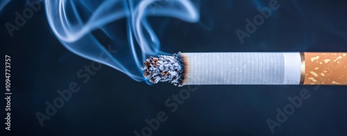 Close-up of a lit cigarette releasing smoke, showcasing the burning tip and ash, representing smoking and health risks. photo