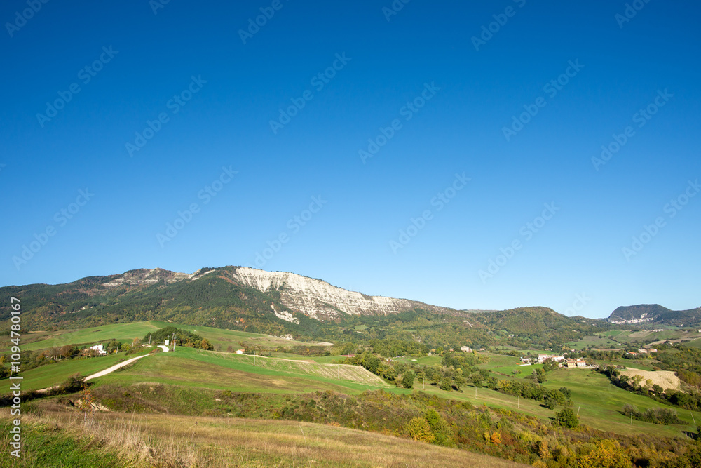 View of the majestic Carpegna Mount in the district of Pesaro and Urbino in the Montefeltro region of the Italian Marches. View of the majestic Carpegna Mount in the district of Pesaro and Urbino in the Montefeltro region of the Italian Marches.