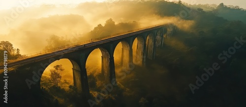 Golden Hour Bridge in Misty Landscape