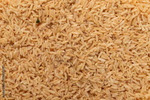 Brown rice background on a plate. rice texture.