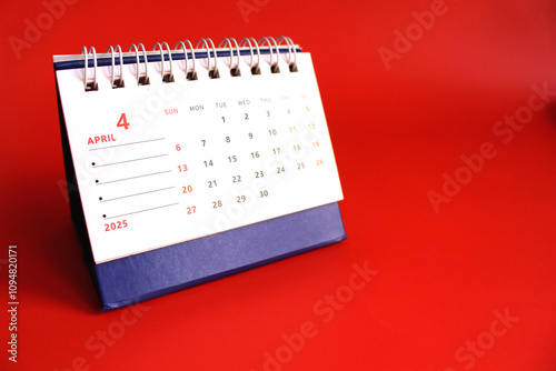 Monthly calendar template for the new year 2025 desk calendar,on red background photo