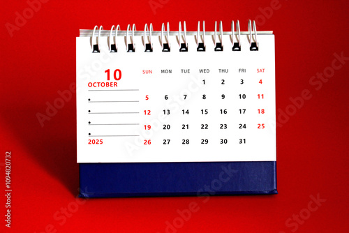 Monthly calendar template for the new year 2025 desk calendar,on red background photo