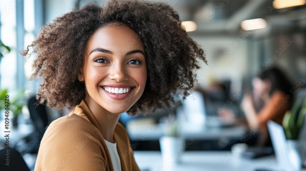 Smiling Young Woman With Curly Hair In Office Setting