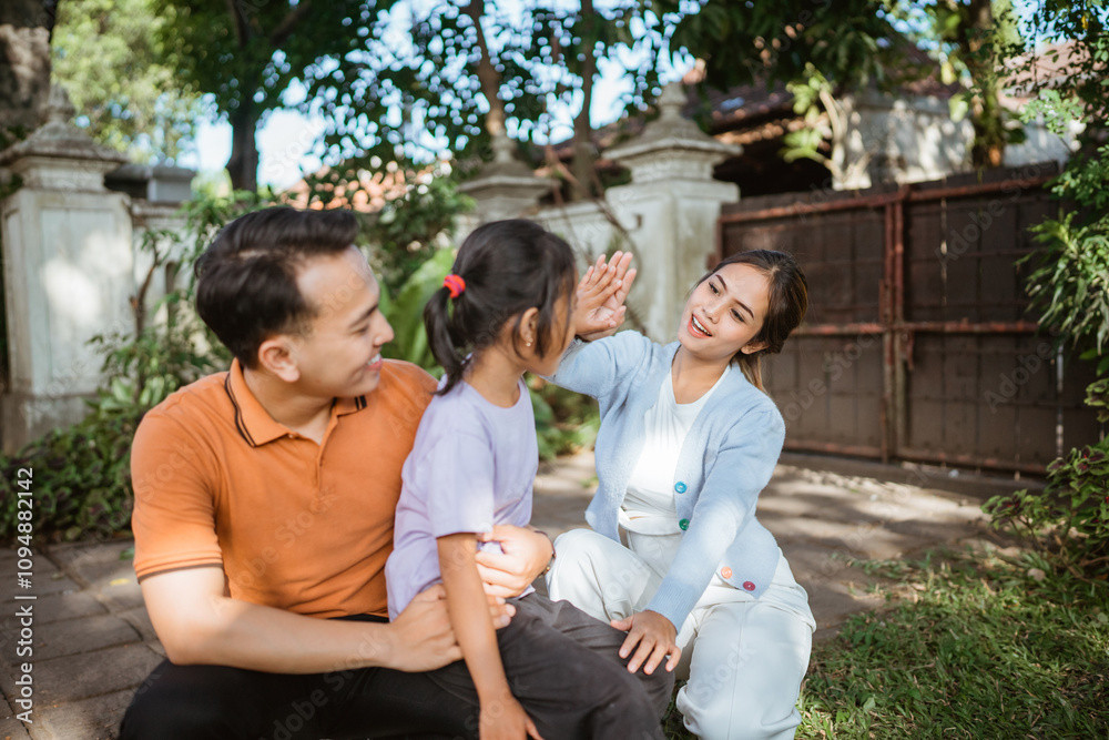 loving mother high five with her daughter on family bonding time