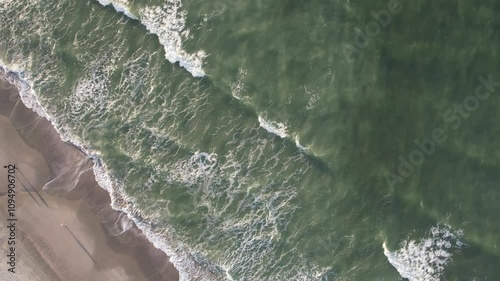 waves crashing into the water