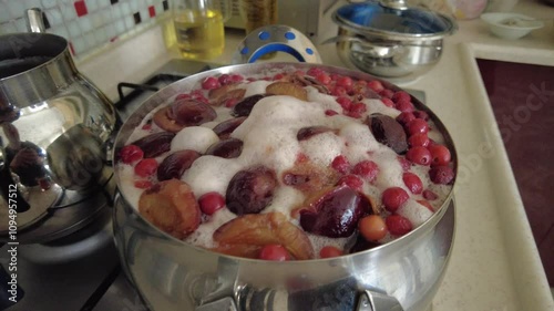 Mixed fruit compote made by boiling in a pot,