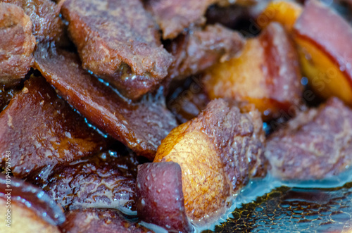 Close up view of pork cooked in soy sauce with customizable space for text. Asian food concept photo