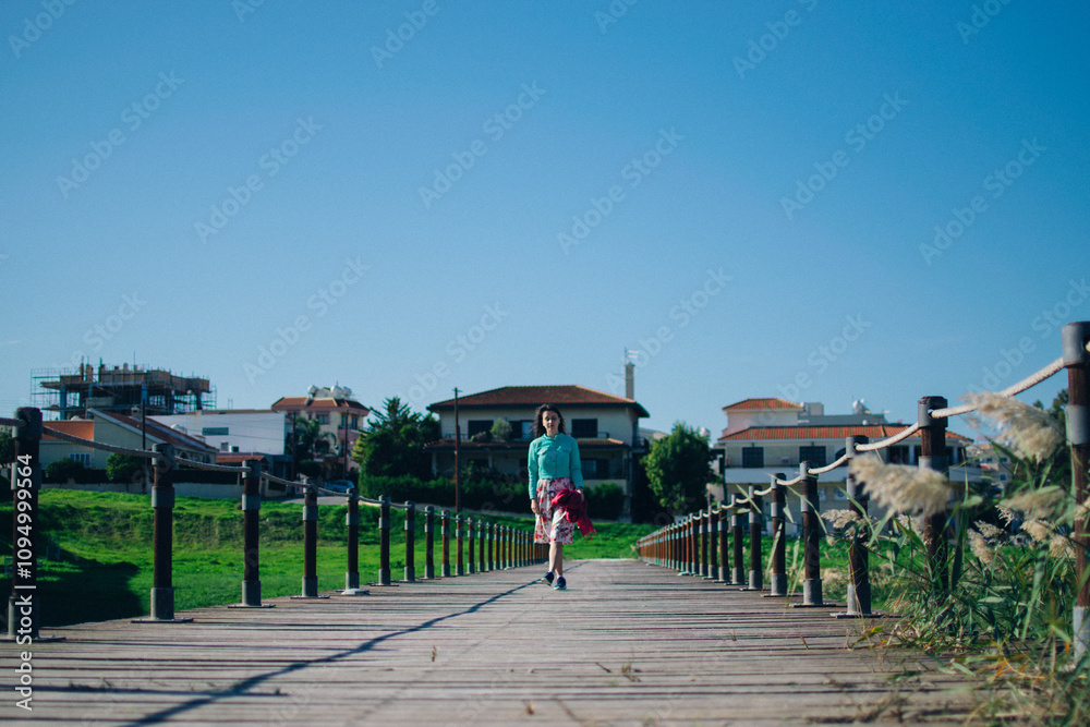 young woman in floral dress near the ancient Kamares Aqueduct, Larnaca, Cyprus young woman in floral dress near the ancient Kamares Aqueduct, Larnaca, Cyprus