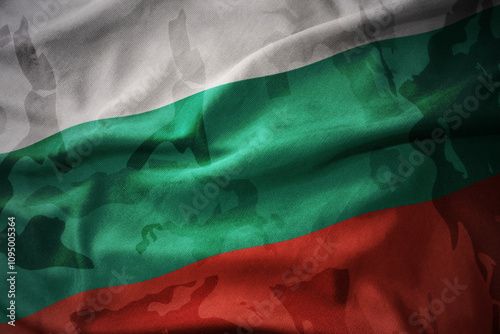 colourful waving flag of bulgaria on the old army khaki texture background. military concept. photo